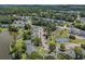 Aerial view of condo community with pool, tennis courts, ponds and mature trees at 537 White River Dr. # 17C, Myrtle Beach, SC 29579