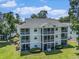 Aerial view of condo complex showcases lush landscaping and outdoor patio living at 537 White River Dr. # 17C, Myrtle Beach, SC 29579