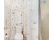 Bathroom featuring a seashell themed shower curtain, along with a toilet and towel rack at 537 White River Dr. # 17C, Myrtle Beach, SC 29579