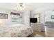 Bright bedroom with wood flooring, closet, ceiling fan, and cozy furnishings for comfortable living at 537 White River Dr. # 17C, Myrtle Beach, SC 29579