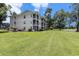 Low-rise condos offer screened lanais, well-kept landscaping and manicured lawns at 537 White River Dr. # 17C, Myrtle Beach, SC 29579