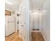 Hallway with utility closet with washer dryer and a view of the front door, refrigerator and kitchen cabinets at 537 White River Dr. # 17C, Myrtle Beach, SC 29579