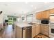 Well-maintained kitchen with modern appliances, oak cabinets, ample counter space, and open floor plan at 537 White River Dr. # 17C, Myrtle Beach, SC 29579