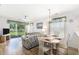 Bright living room/dining area with scenic outdoor views, ceiling fan, and neutral decor to create a welcoming space at 537 White River Dr. # 17C, Myrtle Beach, SC 29579
