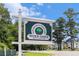 Community sign with mature landscaping at River Oaks Golf & Tennis Resort at 537 White River Dr. # 17C, Myrtle Beach, SC 29579