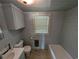 Modest bathroom features light blue walls, toilet, sink, and bathtub at 5370 Miracle Ln., Conway, SC 29526