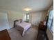 Cozy bedroom with neutral walls, carpet flooring, a window and ample closet space at 5370 Miracle Ln., Conway, SC 29526