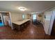Living room featuring a breakfast bar, tile flooring and natural lighting at 5370 Miracle Ln., Conway, SC 29526