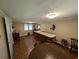 Spacious living room with hardwood-style floors, breakfast bar, and natural light at 5370 Miracle Ln., Conway, SC 29526
