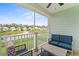 Serene screened porch offers seating and views of the pond and community, perfect for relaxing outdoors at 540 Chanted Dr., Murrells Inlet, SC 29576