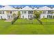 A well-maintained lawn, patio, and black metal fence highlight the backyard of this two-story home at 540 Chanted Dr., Murrells Inlet, SC 29576