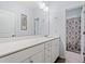Clean bathroom with a white vanity, a large mirror, and neutral colored floors and walls at 540 Chanted Dr., Murrells Inlet, SC 29576