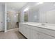 Bright bathroom featuring double sinks, a large mirror, modern fixtures, and a glass-enclosed shower at 540 Chanted Dr., Murrells Inlet, SC 29576