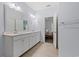 Bright bathroom featuring double sinks with granite counters, a large mirror, and modern fixtures at 540 Chanted Dr., Murrells Inlet, SC 29576