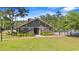 A lush green lawn leads to the charming community clubhouse with a cozy fireplace at 540 Chanted Dr., Murrells Inlet, SC 29576