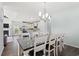 Bright dining room with seating for eight and views of the kitchen, featuring dark wood floors at 540 Chanted Dr., Murrells Inlet, SC 29576