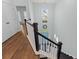 Spacious entryway with dark wood stairs and floors, plus a view to the front door at 540 Chanted Dr., Murrells Inlet, SC 29576