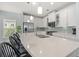 Bright kitchen with white cabinets, stainless steel appliances, bar seating, and pendant lighting at 540 Chanted Dr., Murrells Inlet, SC 29576