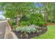 The landscaped corner lot shows off seasonal color from the shrubbery and surrounding trees at 540 Chanted Dr., Murrells Inlet, SC 29576