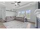 Inviting living room featuring a comfortable gray sofa, large rug and plenty of natural light at 540 Chanted Dr., Murrells Inlet, SC 29576