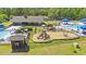 Aerial view of the community playground and pool area with lounge seating and picnic tables at 540 Chanted Dr., Murrells Inlet, SC 29576