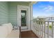 Outdoor porch features a comfortable wicker couch with view of the neighborhood and surrounding houses at 540 Chanted Dr., Murrells Inlet, SC 29576