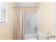 Bright bathroom showcasing a white shower-tub combo, toilet, and window with natural light at 6001- P16A S Kings Highway, Myrtle Beach, SC 29575