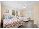 Bright bedroom with two twin beds, matching décor, a ceiling fan, and plenty of natural light at 6001- P16A S Kings Highway, Myrtle Beach, SC 29575