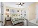Comfortable bedroom featuring ceiling fan, ensuite, and access to an outdoor patio at 6001- P16A S Kings Highway, Myrtle Beach, SC 29575