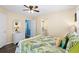 Bedroom boasts a ceiling fan, ensuite, and access to an outdoor patio at 6001- P16A S Kings Highway, Myrtle Beach, SC 29575