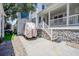Charming home with a covered front porch, stone foundation, and detached garage at 6001- P16A S Kings Highway, Myrtle Beach, SC 29575