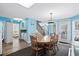 Open-concept kitchen flows into other living spaces with a wooden dining set at 6001- P16A S Kings Highway, Myrtle Beach, SC 29575