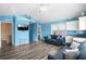 Inviting living room boasting ample seating, a TV, coastal decor, and a glimpse into the bedroom at 6001- P16A S Kings Highway, Myrtle Beach, SC 29575