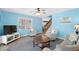 Cozy living room featuring a comfortable seating arrangement, staircase, and bright lighting at 6001- P16A S Kings Highway, Myrtle Beach, SC 29575