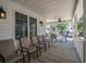 Covered porch with outdoor seating, offering a cozy and inviting space to relax and enjoy the surroundings at 6001- P16A S Kings Highway, Myrtle Beach, SC 29575