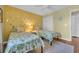 Cozy bedroom with two twin beds, stylish pineapple decor, and comfortable bedding for a relaxing stay at 627 Waterway Village Blvd. # 8E, Myrtle Beach, SC 29579