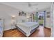 Bright bedroom with hardwood floors, ceiling fan, and access to outdoor balcony with views at 627 Waterway Village Blvd. # 8E, Myrtle Beach, SC 29579