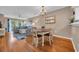 Cozy dining area with wood floors, chandelier and access to a living room with beautiful outdoor views at 627 Waterway Village Blvd. # 8E, Myrtle Beach, SC 29579