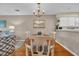 Inviting dining area next to kitchen with wood floors and chandelier providing a cozy setting at 627 Waterway Village Blvd. # 8E, Myrtle Beach, SC 29579