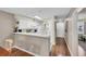 Bright, modern kitchen with breakfast bar seamlessly connected to the entrance and adjacent rooms at 627 Waterway Village Blvd. # 8E, Myrtle Beach, SC 29579