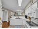 Open kitchen with white cabinets, breakfast bar and stainless steel sink perfect for entertaining at 627 Waterway Village Blvd. # 8E, Myrtle Beach, SC 29579