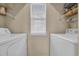 Functional laundry room equipped with a washer and dryer, offering convenience and efficiency at 627 Waterway Village Blvd. # 8E, Myrtle Beach, SC 29579