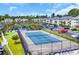 Scenic overhead of the community tennis court, adjacent parking, and a pond feature for an active lifestyle at 627 Waterway Village Blvd. # 8E, Myrtle Beach, SC 29579