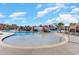 A zero entry pool with a bridge and resort style amenities on a bright sunny day at 7179 Shooting Star Way, Myrtle Beach, SC 29579