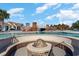 Luxurious pool area featuring a fire pit, bridge, and comfortable seating, perfect for relaxation and socializing at 7179 Shooting Star Way, Myrtle Beach, SC 29579
