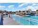 Resort style pool viewed from the bridge leading to the clubhouse, featuring lounge seating at 7179 Shooting Star Way, Myrtle Beach, SC 29579