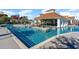 Luxury pool featuring a swim-up bar, lounge area, and sparkling turquoise water at 7179 Shooting Star Way, Myrtle Beach, SC 29579