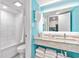 Bright condo bathroom with modern fixtures, granite countertop, and a shower-tub combination for guest convenience at 7200 N Ocean Blvd. # 257, Myrtle Beach, SC 29572