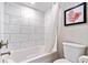 Clean bathroom featuring a tub-shower combination with tile surround, toilet, and neutral walls at 7200 N Ocean Blvd. # 257, Myrtle Beach, SC 29572