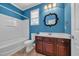 Bathroom with tiled floors, modern vanity, toilet, and tub with tile surround at 760 Carolina Farms Blvd., Myrtle Beach, SC 29579